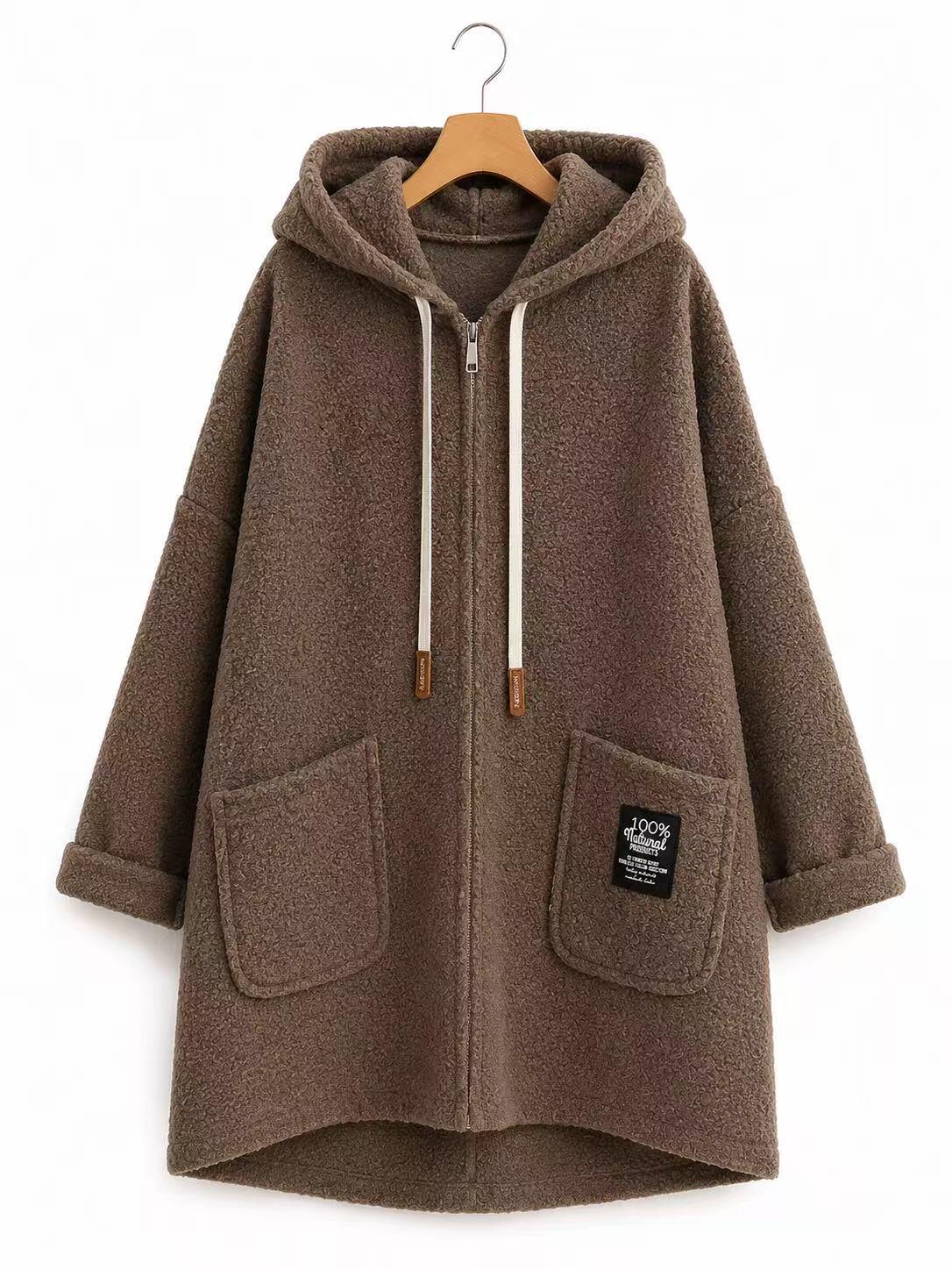 A brown fuzzy zip-up hooded jacket with white drawstrings, displayed on a wooden hanger against a plain white background.