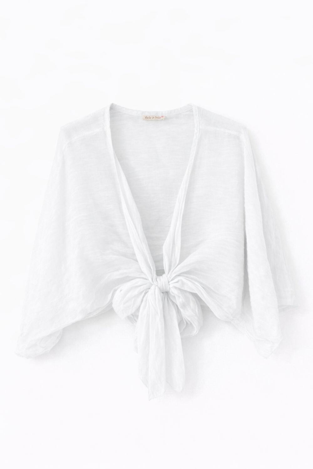 White bolero top with a knot detail on a white background
