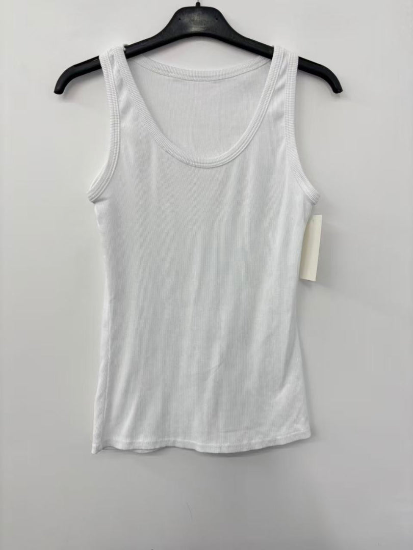 White tank top on a hanger against a white background