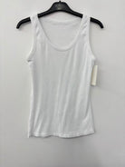 White tank top on a hanger against a white background