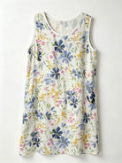 A sleeveless white dress with a colourful watercolor floral print 