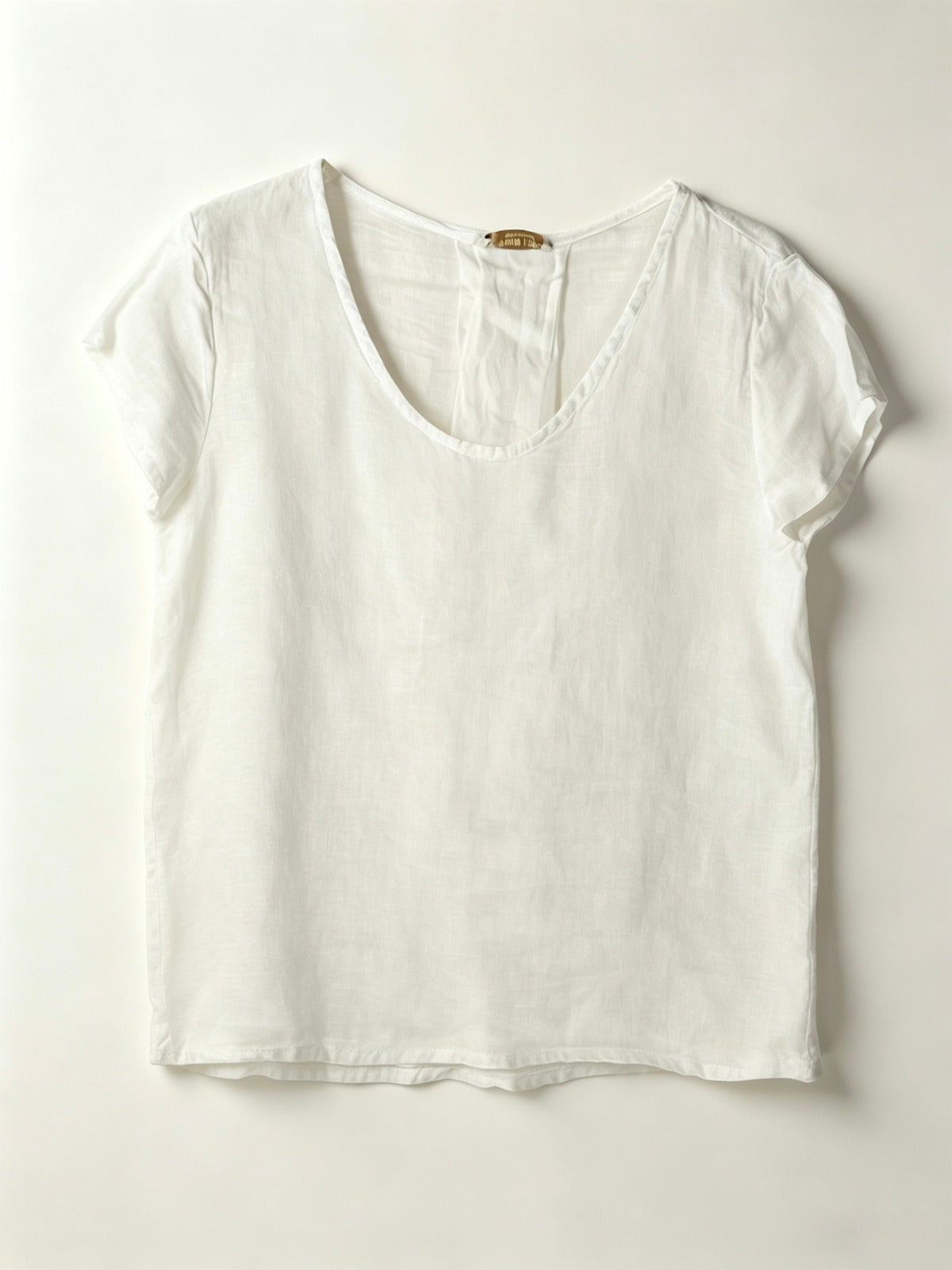 White t-shirt on a light gray background