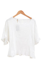 White ruffled top linen cotton mix on a white backround