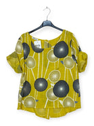 Yellow blouse with black and white pattern 