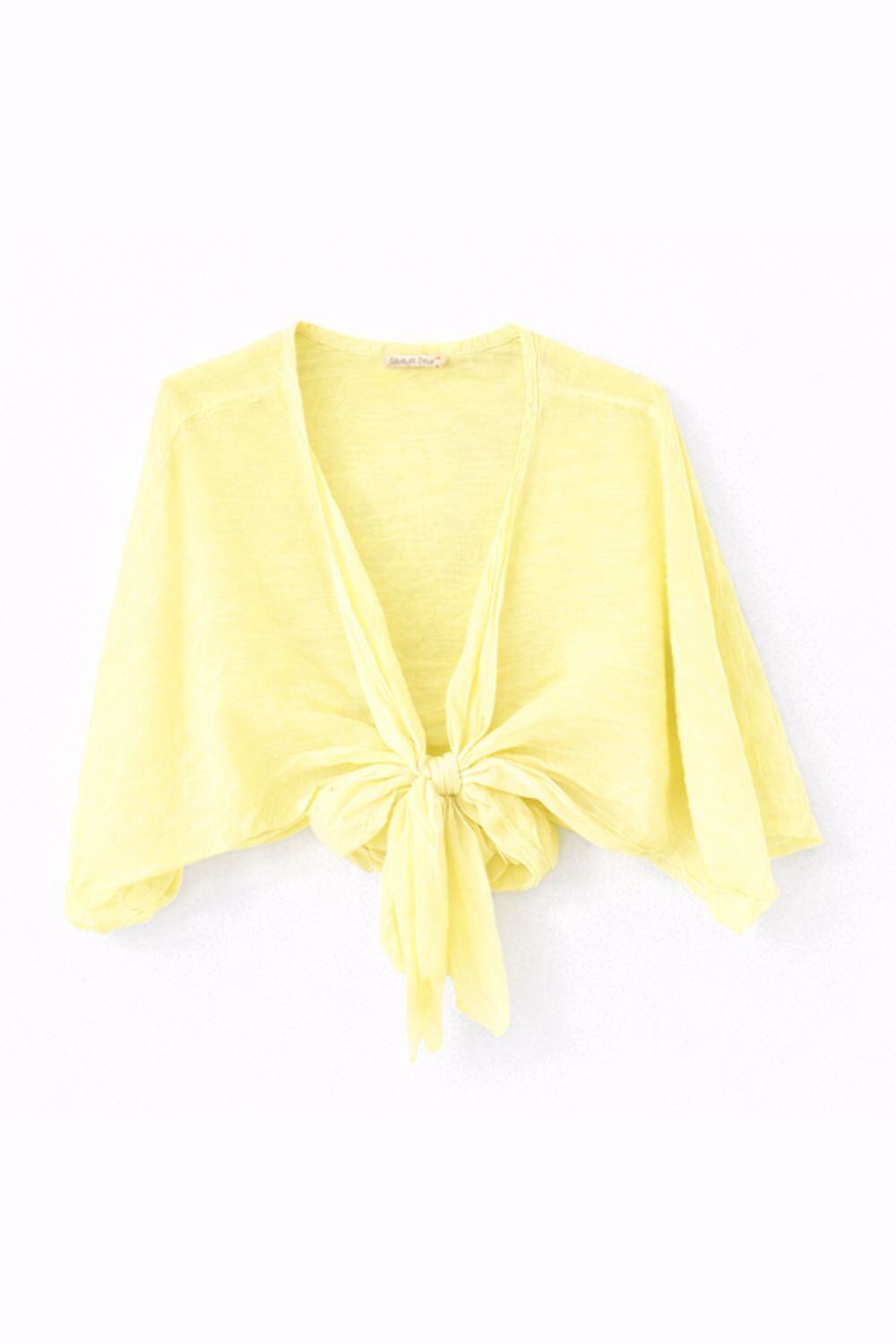 Yellow cardigan with a knot detail on a white background
