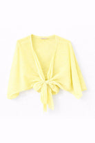 Yellow cardigan with a knot detail on a white background
