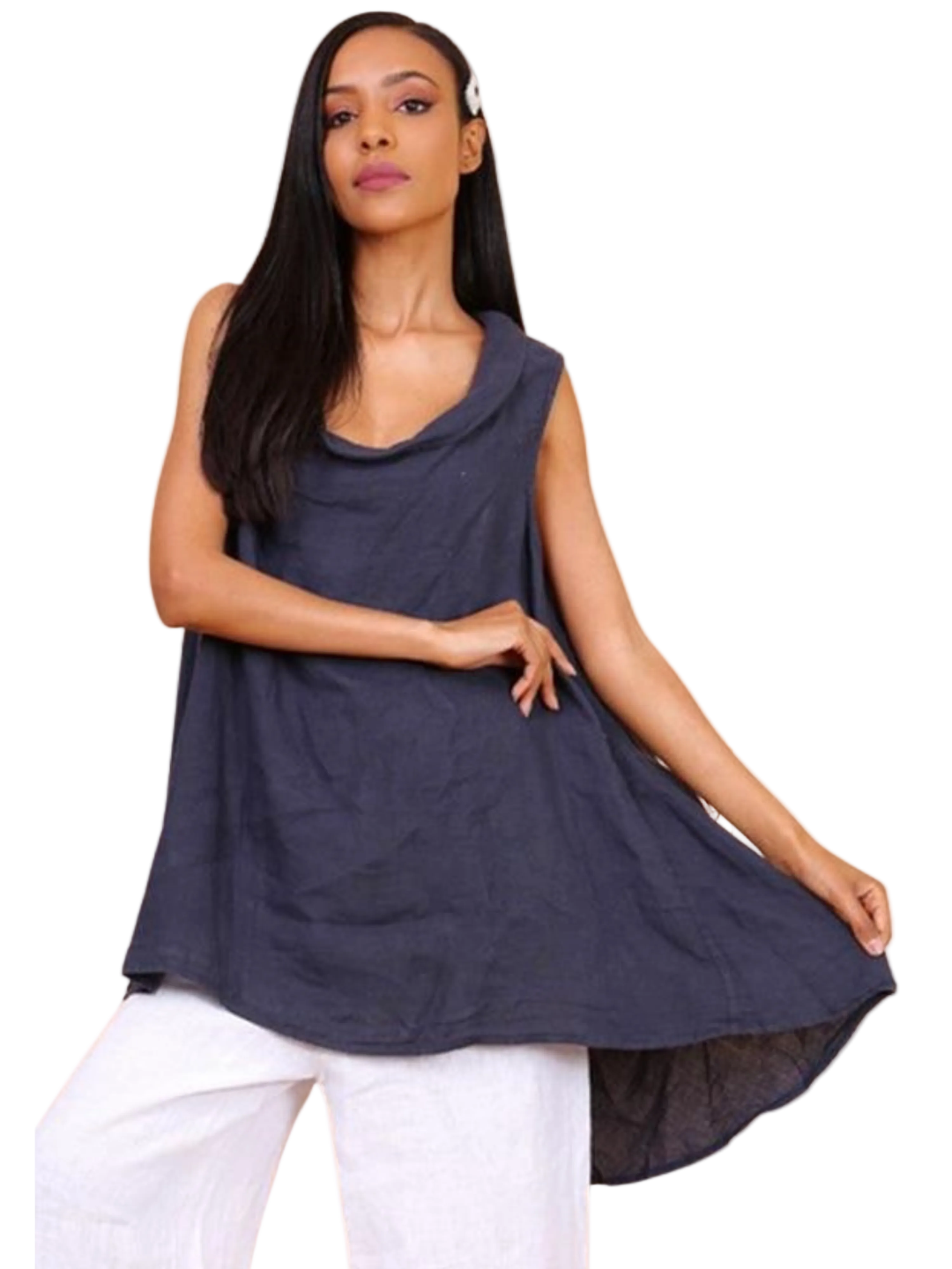 A woman wearing a navy blue sleeveless cowl neck top with an asymmetrical hem, paired with white trousers.