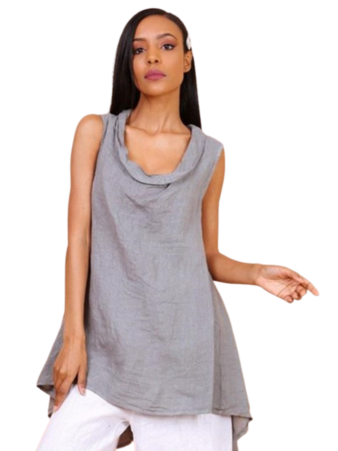A woman wearing a taupe sleeveless cowl neck top with an asymmetrical hem, paired with white trousers.